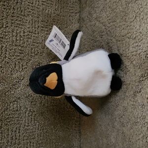 Mini stuffed penguin doll with tags. Collected, great condition.